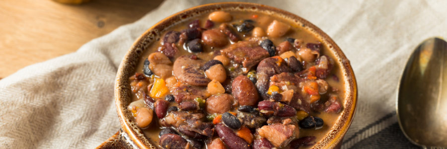 Bowl of baked beans with multiple types of beans.