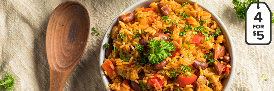 Bowl of rice and beans garnished with parsley