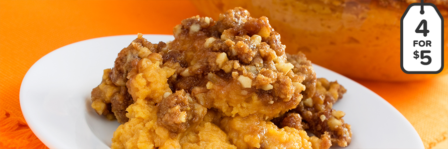 Plate of whipped pumpkin topped with a graham cracker topping.