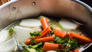 Stock pot with veggie scraps.